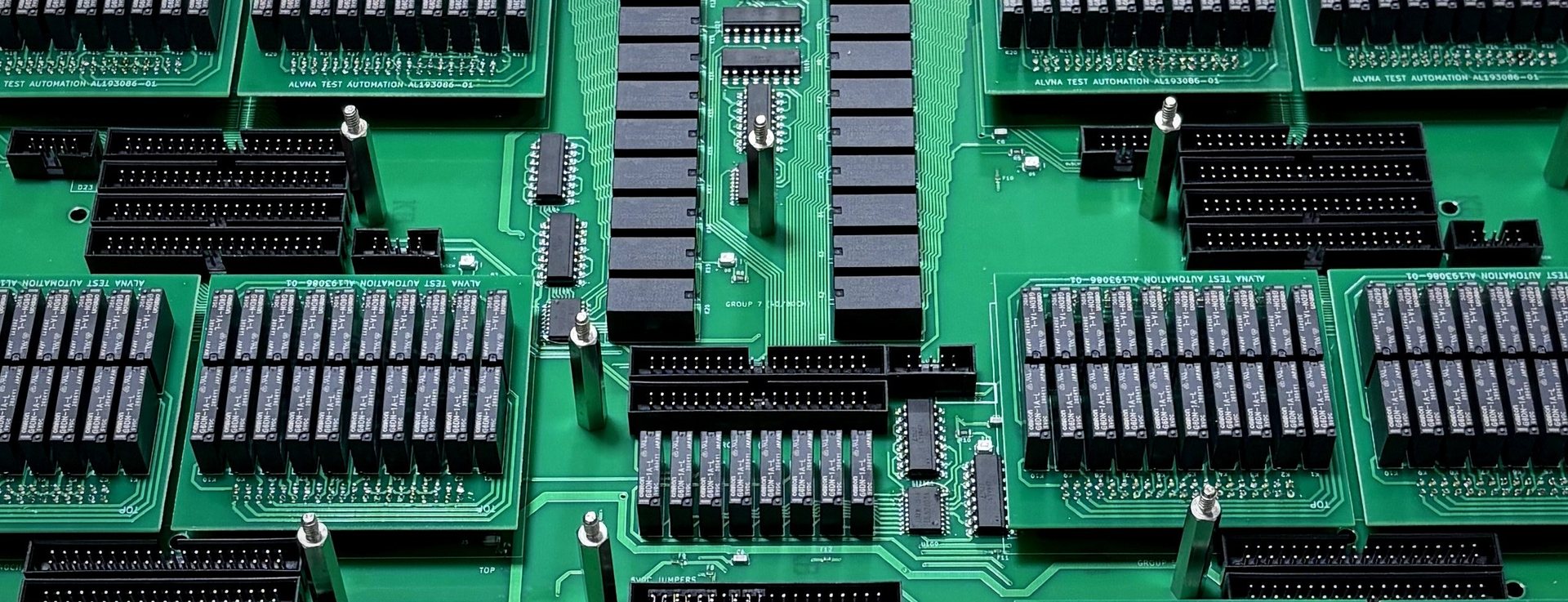 Close-up of ALVNA relay control boards, grouped in labeled channel banks